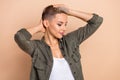 Photo of beautiful satisfied hairdress result blonde short style women wear khaki trendy shirt flawless isolated on