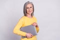 Photo of beautiful smiling positive sweet mature businesswoman in glasses hold laptop isolated on grey color background Royalty Free Stock Photo