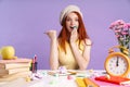 Photo of beautiful student girl pointing finger while sitting with books Royalty Free Stock Photo