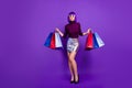 Photo of beautiful stylish lady holding many packs in hands send air kiss wear trendy outfit  purple background Royalty Free Stock Photo