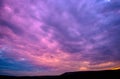 Violet sunset with clouds Royalty Free Stock Photo