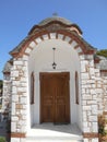 The enter of church of Agios Nikolaos and Agia Anastasia at the fishing harbour of Olympiada, Halkidiki
