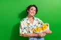 Photo of beautiful young dreamy girlfriend holding handmade basket for organic fresh fruits lemon citrus isolated on