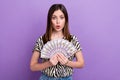 Photo of beautiful young millionaire girl wear zebra shirt hold much money open mouth bet played win isolated on purple