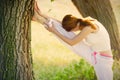 Photo of beautiful young woman doing joga on the wonderful trees Royalty Free Stock Photo