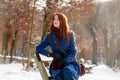 Photo of beautiful young woman sitting on the bench in the park Royalty Free Stock Photo