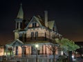 Photo of a beautifully illuminated Victorian house at night Royalty Free Stock Photo