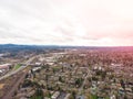 A photo of Beaverton, Oregon, USA, at sunset, a suburb. A photo from a height at sunset or sunrise. Design background