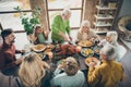 Photo of big family sit feast dishes table around roasted turkey eldest grandfather making slices hungry relatives