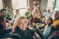 Photo of big family sit feast dishes table around roasted turkey multi-generation relatives making group selfies raising