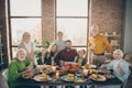 Photo of big family sitting hugging feast table holiday roasted turkey making portrait eight relatives wife husband