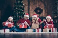 Photo of big family wondered dad mom sister brother opening x-mas gifts sitting floor near decorated garland lights Royalty Free Stock Photo