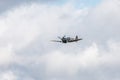 Photo of a spitfire fighter plane starting it`s flypast Royalty Free Stock Photo