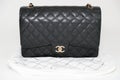 Photo of black Chanel handbag brand Editorial on white background. Royalty Free Stock Photo