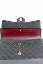 Photo of black Chanel handbag brand Editorial on white background. Royalty Free Stock Photo