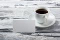 Photo blank b-cards with cup of coffee on a wooden texture. Copy space for your ad. Royalty Free Stock Photo
