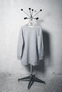 Photo of blank sweatshirt hanging on the hanger. Vertical