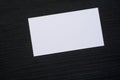 Photo of blank white business cards on a dark wooden background. Mock-up for branding identity. Royalty Free Stock Photo