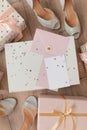 Photo of Blank white card in pink envelope isolated woodden color background with glitter stars, vaucher, gift certificate. White Royalty Free Stock Photo