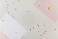 Photo of Blank white card in pink envelope isolated woodden color background with glitter stars, vaucher, gift certificate. White Royalty Free Stock Photo