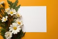 Photo of blank white paper with flower on yellow background Card for Mothers day, 8 March, Happy Easter. Waiting for spring Royalty Free Stock Photo