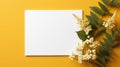 Photo of blank white paper with flower on yellow background Card for Mothers day, 8 March, Happy Easter. Waiting for spring Royalty Free Stock Photo