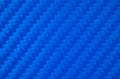 Photo of the blue carbon fiber texture. Blue vinyl film for pasting sports cars. Racing style. Sporty blue background. Royalty Free Stock Photo