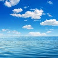 Photo of blue clear bay waves with sky and clouds Royalty Free Stock Photo