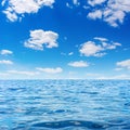 Photo of blue clear bay waves with sky and clouds Royalty Free Stock Photo