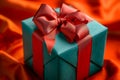 A photo of a blue gift box with a red bow, neatly wrapped and ready for gifting, Vibrant gift box with a big red bow, AI Generated Royalty Free Stock Photo