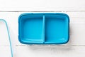 Photo of blue lunchbox with lid