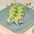 Blue Plate With Avocado-Topped Sushi Royalty Free Stock Photo