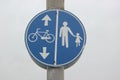 Blue traffic sign bicycle and pedestrians Royalty Free Stock Photo