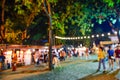 Photo Blur - Defocus or out of focus people walking around the night tourism festival in a park in Bangkok, Thailand, Night market