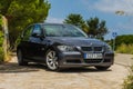 JULY 2018: BMW 3 series E90 330i Sparkling Graphite at the mountain road. Royalty Free Stock Photo