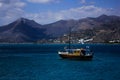 Photo of a boat in front of mountains