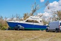 Photo of a boat pinning down a pick up truck after Hurricane Ian storm surge aftermath