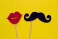 Photo booth props lips and Black Mustache against yellow background