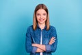 Photo of boss little blond girl crossed arms wear jeans shirt isolated on blue color background Royalty Free Stock Photo