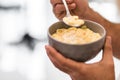 Photo of bowl of corn flakes with milk and spoon inside isolated on blurred background. Royalty Free Stock Photo