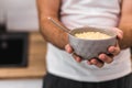 Photo of bowl of corn flakes with milk and spoon inside isolated on blurred background. Royalty Free Stock Photo