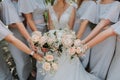Photo of the bride and bridesmaids with wedding bouquets. Wedding day Royalty Free Stock Photo