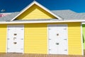 photo of bright beach hut in summer. yellow beach hut in summer vacation. beach hut in summer.