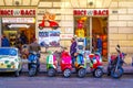 Bright colCorful scooters parked against the wall, the spirit of Italy