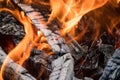 Photo Burning firewood and coals.Flaming burning sparks close-up, fire patterns.View of red hot glowing wood inside stove.Embers