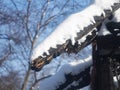 Photo of a burnt house in winter. Charred beams of a wooden house. Burned down house