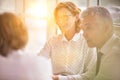 Business colleagues discussing while sitting at table in new office Royalty Free Stock Photo