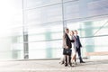 Business people walking while talking in airport Royalty Free Stock Photo