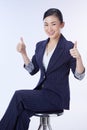 Photo of business woman charming cheerful cute nice advising you well thumbing up giving feedback recommendation isolated, Royalty Free Stock Photo