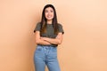 Photo of business woman japanese folded arms wear khaki trendy t-shirt looking empty space smart ideas isolated on beige